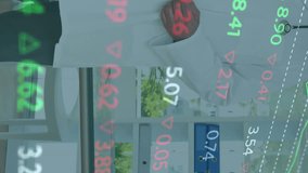 Animation of stock market data processing over caucasian male doctor smiling at hospital. Global economy and medical healthcare technology concept - Powered by Shutterstock - Get 15% off with code: PIKWIZARD15