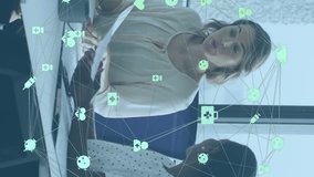 Animation of connected icons forming globe, diverse female coworkers discussing reports on laptop. Digital composite, multiple exposure, globalization, communication, teamwork, technology, business. - Powered by Shutterstock - Get 15% off with code: PIKWIZARD15