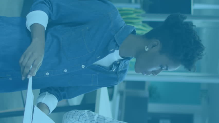 Animation of multiple notification bars over diverse coworkers discussing reports in office. Digital composite, multiple exposure, business, social media reminder and teamwork concept. - Powered by Shutterstock - Get 15% off with code: PIKWIZARD15