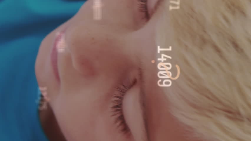 Animation of changing numbers and symbols over caucasian student writing in book. Digital composite, multiple exposure, growth, business, childhood, education and school concept.