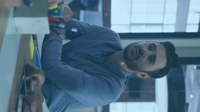 Animation of connected dots forming hexagons over diverse man discussing with colleagues in meeting. Digital composite, telecommunication, networking, business, teamwork, ideas, planning, office. - Powered by Shutterstock - Get 15% off with code: PIKWIZARD15