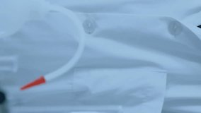 Animation of scientific data processing over caucasian male scientist in laboratory. Global science, connections, computing and data processing concept digitally generated video. - Powered by Shutterstock - Get 15% off with code: PIKWIZARD15