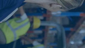 Facial recognition animation over warehouse workers and smiling businesswoman. Technology, surveillance, security, identification, artificial intelligence, AI - Powered by Shutterstock - Get 15% off with code: PIKWIZARD15