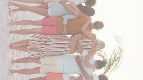 Group of friends on beach with American flag animation overlay. celebration, USA, patriotism, summer, outdoors, vacation - Powered by Shutterstock - Get 15% off with code: PIKWIZARD15