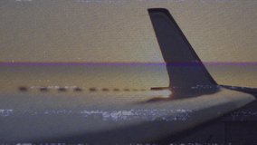 wing and tail fin starting with flickering scan lines, shifting sky gradient capturing fading light. Aviation, sunset, golden hour, vintage, tranquility, adventure, serene - Powered by Shutterstock - Get 15% off with code: PIKWIZARD15