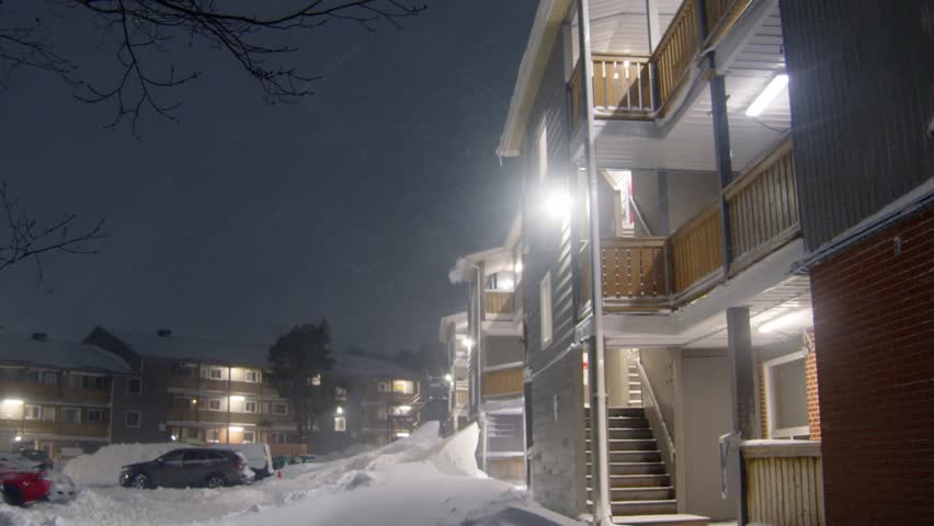 A Powerful Blizzard Hits Dartmouth As Snow Piles Up On The Roads. Streetlights Reveal Endless Falling Flakes, Creating A Stunning But Dangerous Winter Landscape In Nova Scotia.