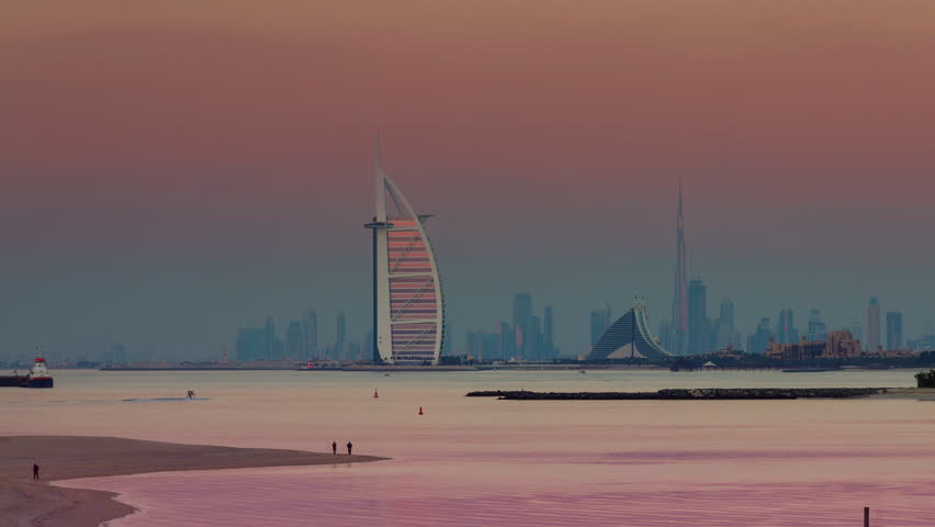sunset light dubai city famous hotel building bay panorama 4k timelapse uae