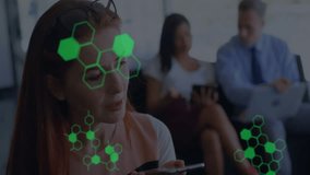 Woman speaking into phone issuing voice commands, showing green code hexagon graphics for tech demo. Technology, innovation, collaboration, digital, networking, futuristic, office - Powered by Shutterstock - Get 15% off with code: PIKWIZARD15