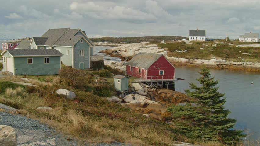 Surrounded By Giant Granite Slabs And Open Ocean, The Lighthouse At Peggys Cove Is A Symbol Of Maritime Beauty In Nova Scotia And A Favorite Stop For Locals And Tourists Alike