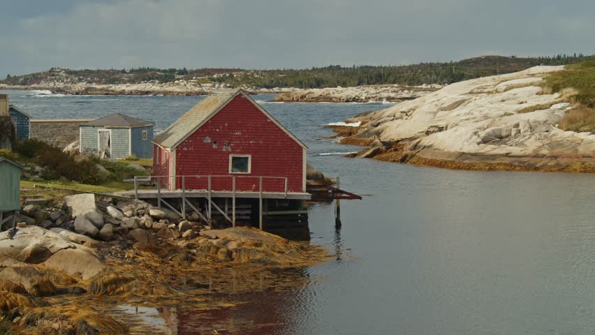 Peggys Cove Offers Breathtaking Scenery As Visitors Walk Along Its Rocky Landscape, Admiring The Lighthouse, Listening To Ocean Waves, And Enjoying One Of Nova Scotia Coastal Treasures