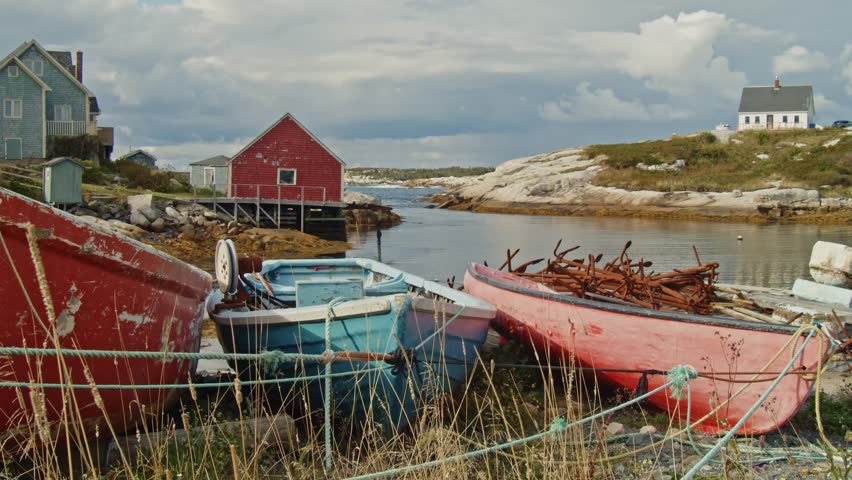 A Mystical Scene In Peggys Cove, Where Morning Fog Rolls Over The Ocean And Granite Rocks, Shrouding The Famous Lighthouse And Creating A Quiet, Dreamy Setting On The Canadian East Coast