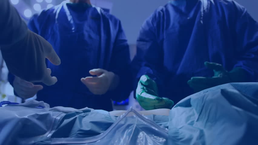 Surgeons placing instruments causing holographic map emerging over table analyzing medical data. Medical, innovation, futuristic, collaboration, technology, precision, healthcare - Powered by Shutterstock - Get 15% off with code: PIKWIZARD15