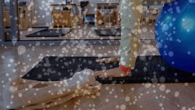 Senior woman pressing on black mat balancing on blue stability ball in studio improving balance. Wellness, balance, strength, elderly fitness, stability, rehabilitation, mindfulness - Powered by Shutterstock - Get 15% off with code: PIKWIZARD15