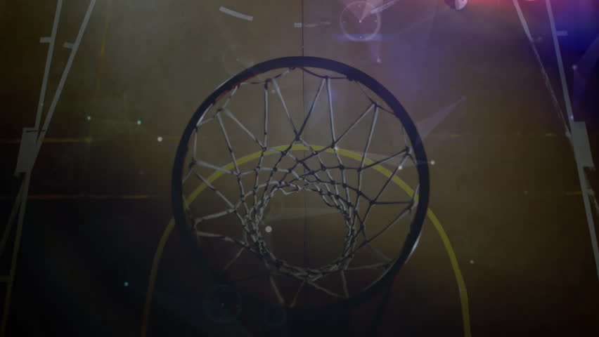 Hooper dribbling, leaping and dunking ball through hoop with digital overlays animating sports tech. Athletic, sports, dynamic, modern, competitive, energized, training