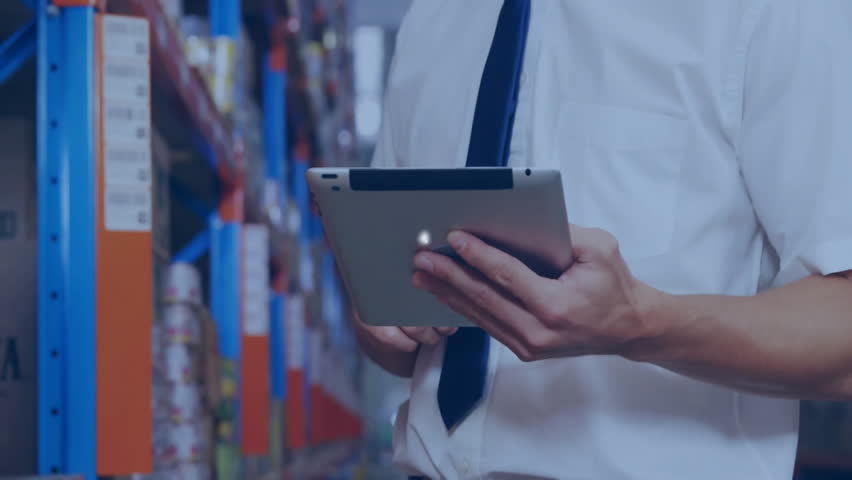 Man tapping tablet in warehouse forming expanding user icon network highlighting logistics flow. Technology, connection, network, digital, corporate, communication, data