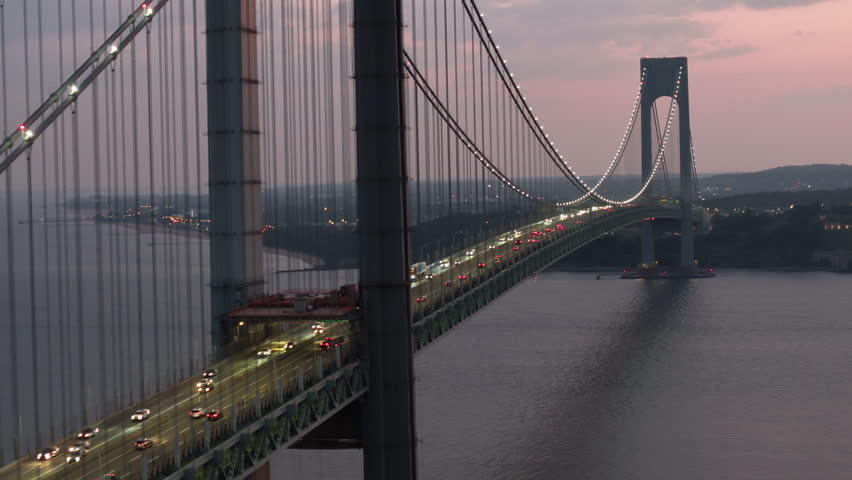 Aerial view of the Verrazzano-Narrows Bridge at night. Shot in Brooklyn looking towards Staten Island.
