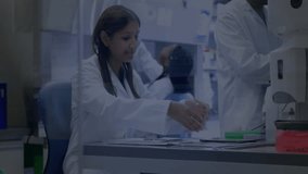 Lab scientist picking tablet scrolling chart analyzing data while colleague loading centrifuge. Biomedical, research, laboratory, professional, scientific, collaboration, innovative - Powered by Shutterstock - Get 15% off with code: PIKWIZARD15