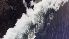 Animation of statistical data processing over aerial view of sea waves hitting the rocks. Global finance and business technology concept - Powered by Shutterstock - Get 15% off with code: PIKWIZARD15
