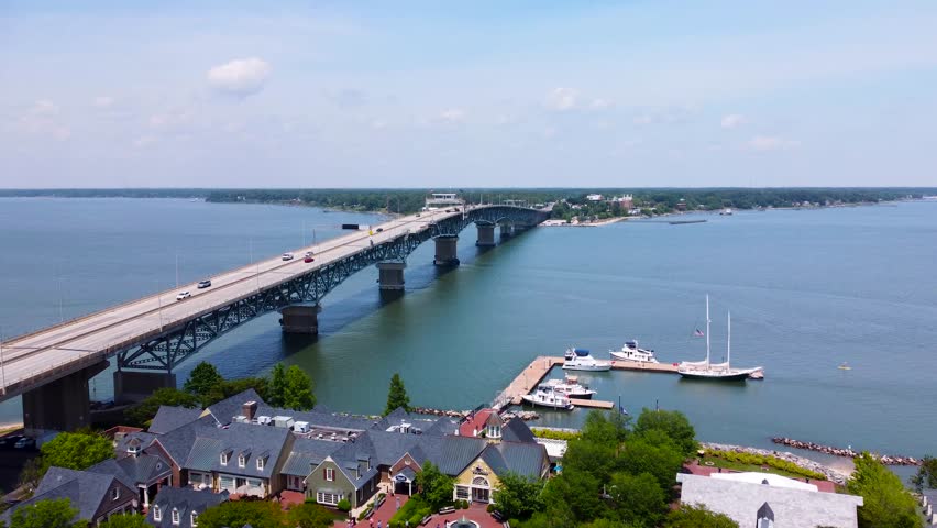 Aerial cinematic video of downtown Yorktown Virginia and the Coleman Bridge spanning the York River.