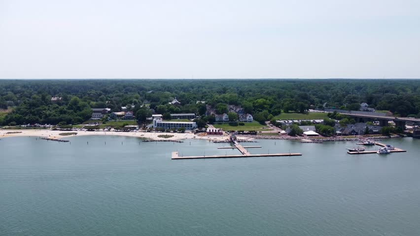 Yorktown, Virginia aerial cinematic video of the waterfront, beaches, marina, and surrounding buildings along the York River.