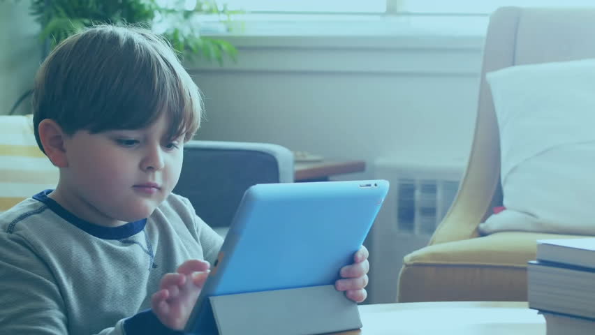 Child lifting tablet and swiping touchscreen while data charts animating across screen for learning. Technology, education, digital, entertainment, innovation, youth, home - Powered by Shutterstock - Get 15% off with code: PIKWIZARD15