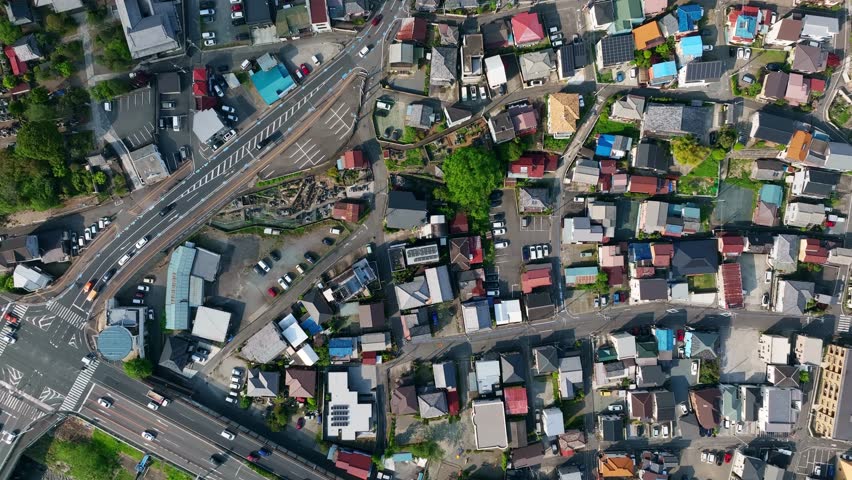 Directly above aerial view of modern city and roads