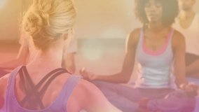 Blonde yoga instructor initiating breathing on mats with golden overlay, lens flares for calm mind. Mindfulness, relaxation, serenity, wellness, tranquility, meditation, holistic - Powered by Shutterstock - Get 15% off with code: PIKWIZARD15