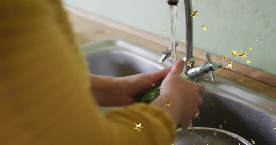 Woman turning on faucet and washing lettuce for food prep with animated water drops showing rinse. Kitchen, household, cleaning, sanitary, freshness, lifestyle, natural