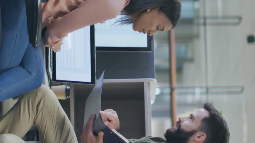 Animation of data processing over diverse male and female colleague discussing at casual office. Network, data, digital interface, teamwork, business and communication, digitally generated video. - Powered by Shutterstock - Get 15% off with code: PIKWIZARD15