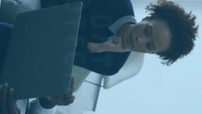 Two people discussing work over laptop with digital interface animation overlay. Collaboration, teamwork, technology, business, communication, innovation - Powered by Shutterstock - Get 15% off with code: PIKWIZARD15