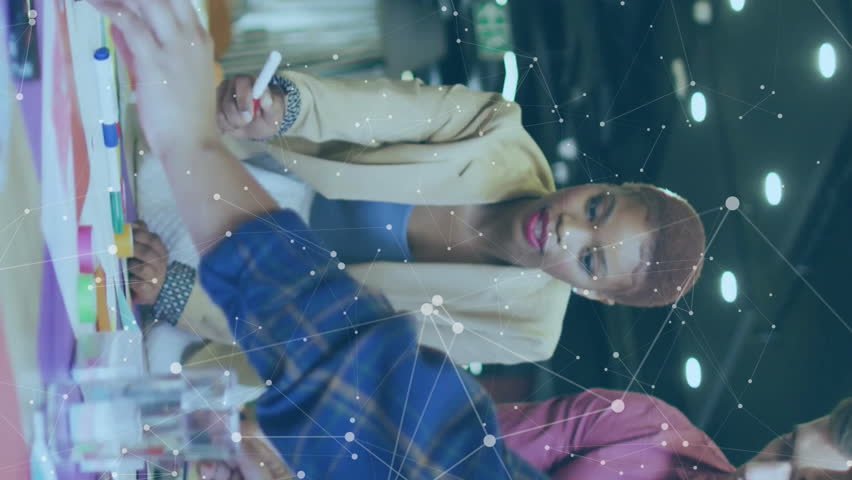 Collaborating on animation project, diverse team using digital data in modern office. Teamwork, brainstorming, technology, creativity, collaboration, design - Powered by Shutterstock - Get 15% off with code: PIKWIZARD15