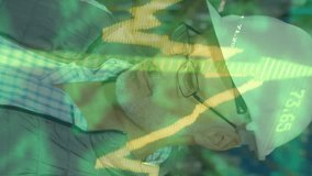 In warehouse, man smiling with stock market animation overlay on screen. Economy, finance, investment, technology, digital, business - Powered by Shutterstock - Get 15% off with code: PIKWIZARD15