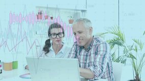 Woman pointing at financial charts on laptop and man typing while discussing data trends. Professional, collaboration, data, productivity, modern, analytical, teamwork - Powered by Shutterstock - Get 15% off with code: PIKWIZARD15