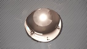  Detailed view of a switched-on recessed light in a perforated ceiling. Modern ceiling lighting suitable for offices, medical facilities, and technical spaces. - Powered by Shutterstock - Get 15% off with code: PIKWIZARD15