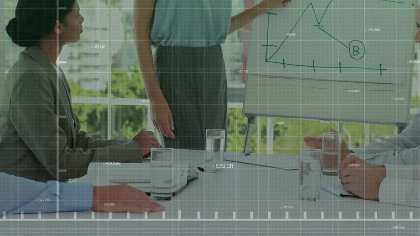 Presenter picking up blue marker and tracing graph slopes during data analysis meeting with overlay. Corporate, teamwork, presentation, analytics, collaboration, modern, professional - Powered by Shutterstock - Get 15% off with code: PIKWIZARD15