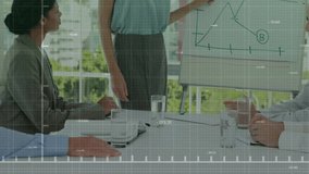 Presenter picking up blue marker and tracing graph slopes during data analysis meeting with overlay. Corporate, teamwork, presentation, analytics, collaboration, modern, professional - Powered by Shutterstock - Get 15% off with code: PIKWIZARD15