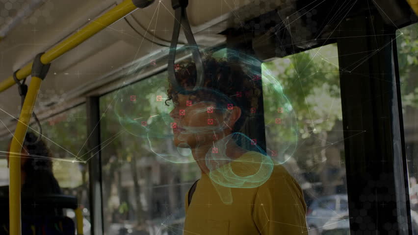 Commuter gripping strap during bus sway while activating transparent brain tech overlay for demo. Futuristic, technology, innovation, urban, neural, connectivity, visualization - Powered by Shutterstock - Get 15% off with code: PIKWIZARD15
