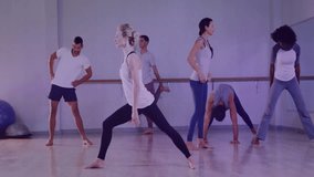 instructor woman stepping into lunge guiding barre class matching stances with overlay bar graphs. Fitness, wellness, stretching, empowerment, healthy lifestyle, movement, interior - Powered by Shutterstock - Get 15% off with code: PIKWIZARD15