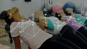 Group performing Pilates back extension on reformers on cue, digital overlay showing core strength. Fitness, strength, wellness, exercise, training, posture, health - Powered by Shutterstock - Get 15% off with code: PIKWIZARD15