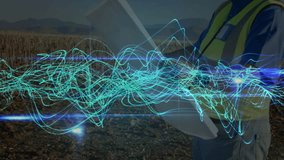 engineer entering field holding tablet starting turquoise waves while tracking wind turbine metrics. Renewable energy, digital technology, outdoor, clean energy, monitoring, data visualization, - Powered by Shutterstock - Get 15% off with code: PIKWIZARD15