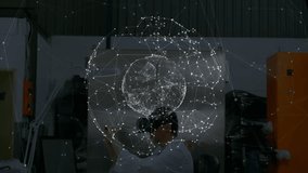 Man placing VR headset and manipulating rotating network sphere for data exploration in workshop. Technology, innovation, digital, interface, futuristic, immersive, engineering - Powered by Shutterstock - Get 15% off with code: PIKWIZARD15