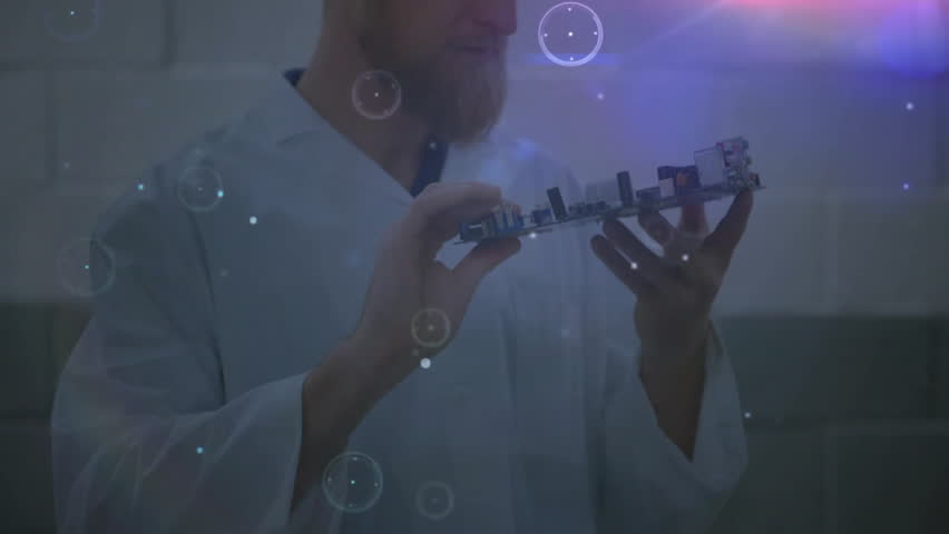 Technician lifting circuit board, inspecting parts as holographic overlays intensifying converging. Electronics, innovation, futuristic, engineering, technology, digital, visualization - Powered by Shutterstock - Get 15% off with code: PIKWIZARD15