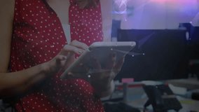 Woman tapping white tablet screen in office, generating data graphs for tech briefing. Technology, analytics, innovation, workspace, digital, business, collaboration - Powered by Shutterstock - Get 15% off with code: PIKWIZARD15