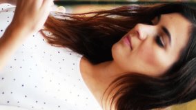 Animation of media icon over caucasian businesswoman using smartphone. Global business and digital interface concept digitally generated video. - Powered by Shutterstock - Get 15% off with code: PIKWIZARD15