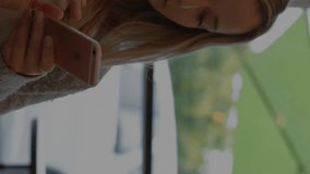 Animation of social media data processing over caucasian woman using smartphone. Global social media, networks, computing and data processing concept digitally generated video. - Powered by Shutterstock - Get 15% off with code: PIKWIZARD15