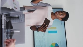 Animation of multiple digital icons against african american woman giving a presentation at office. Computer interface and business technology concept - Powered by Shutterstock - Get 15% off with code: PIKWIZARD15