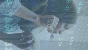 Animation of stock market data processing against woman in hijab having a snack on the street. Global economy and business data technology concept - Powered by Shutterstock - Get 15% off with code: PIKWIZARD15