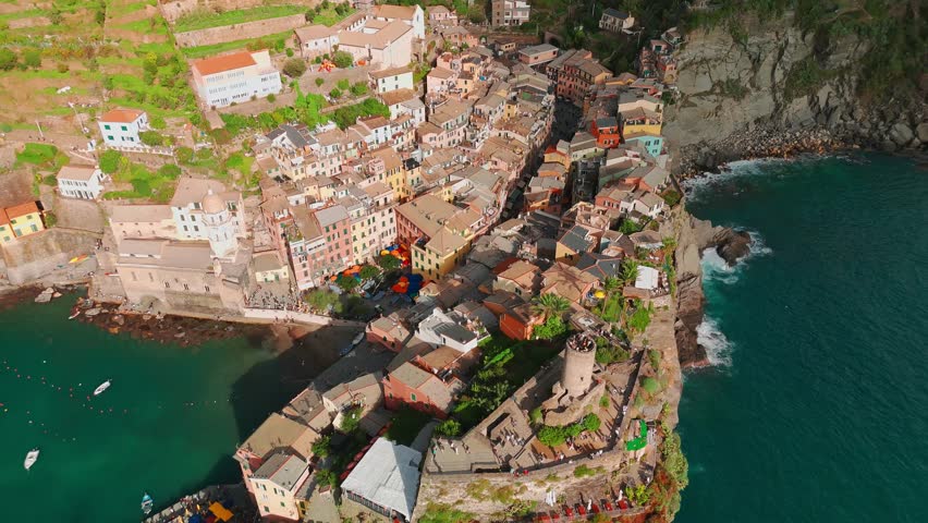 Aerial view of the picturesque town of Vernazza, Cinque Terre, Italian Riviera, Liguria, Italy. Stunning historic village with colorful buildings nestled between cliffs and the Ligurian Sea. 
