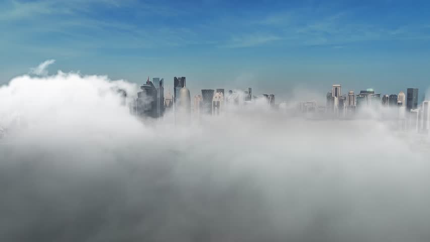 Aerial footage of Doha skyline Over the clouds