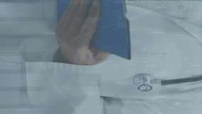 Animation of statistical data processing over caucasian male doctor writing on clipboard at hospital. Business data and medical healthcare technology concept - Powered by Shutterstock - Get 15% off with code: PIKWIZARD15